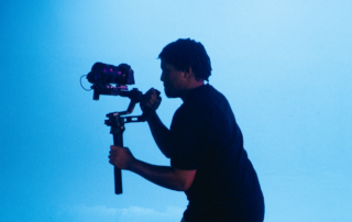 Youth videographer filming at Next Move Media Academy